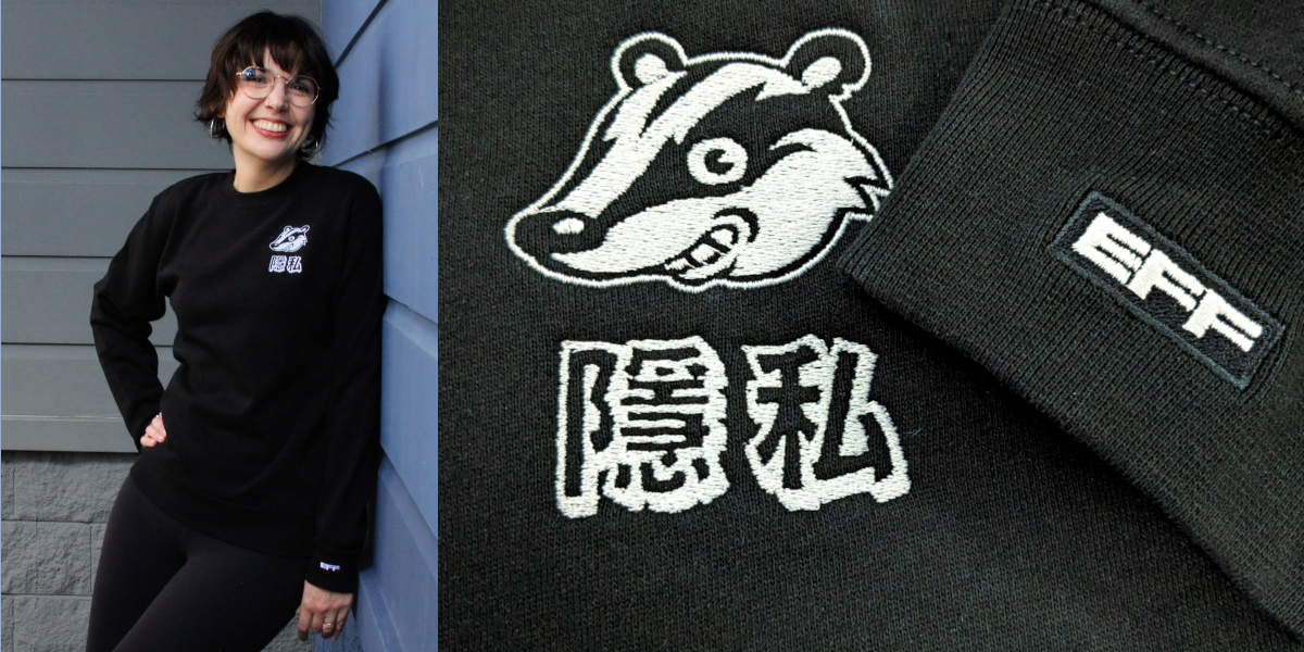Person wearing a black crewneck sweater with the Privacy Badger logo on the chest